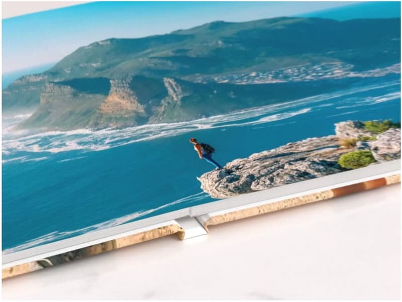 A premium TRIPPAL travel photobook, opened to a designed spread
